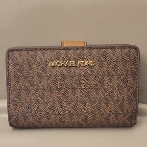 Sold.    Michael Kors Textured Brown Wallet with Gold Logo